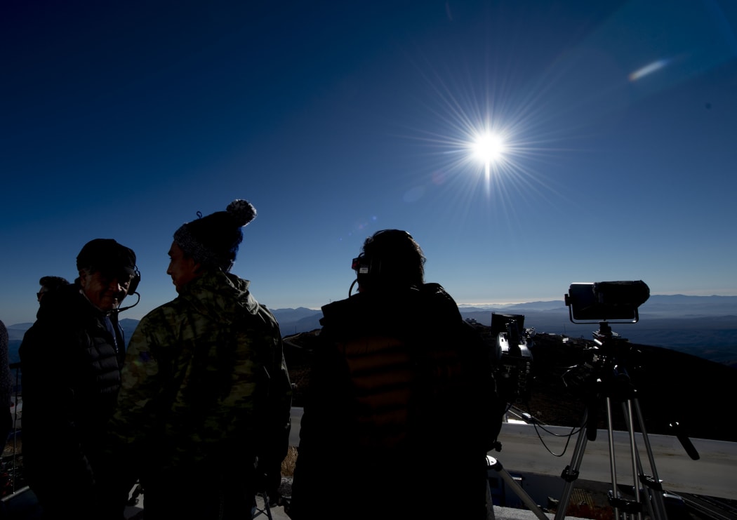 People watch a solar eclipse at La Silla European Southern Observatory (ESO) in La Higuera, Coquimbo Region, Chile.