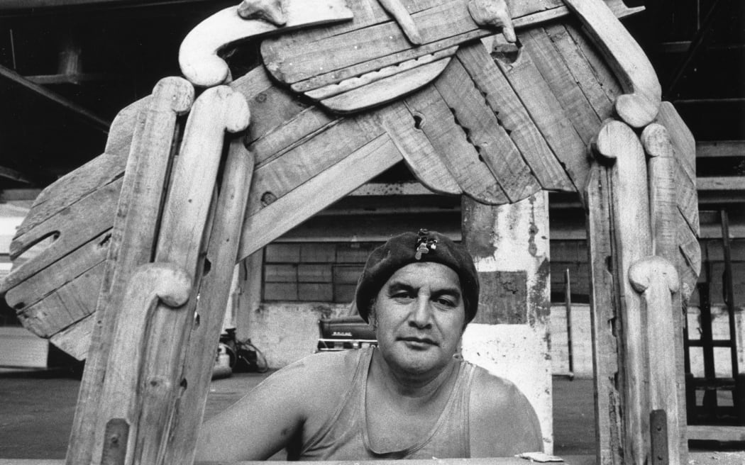Maori artist Selwyn Muru in his workshop with the Waharoa sculpture. Muru is a sculptor, film-maker, composer, and broadcaster.