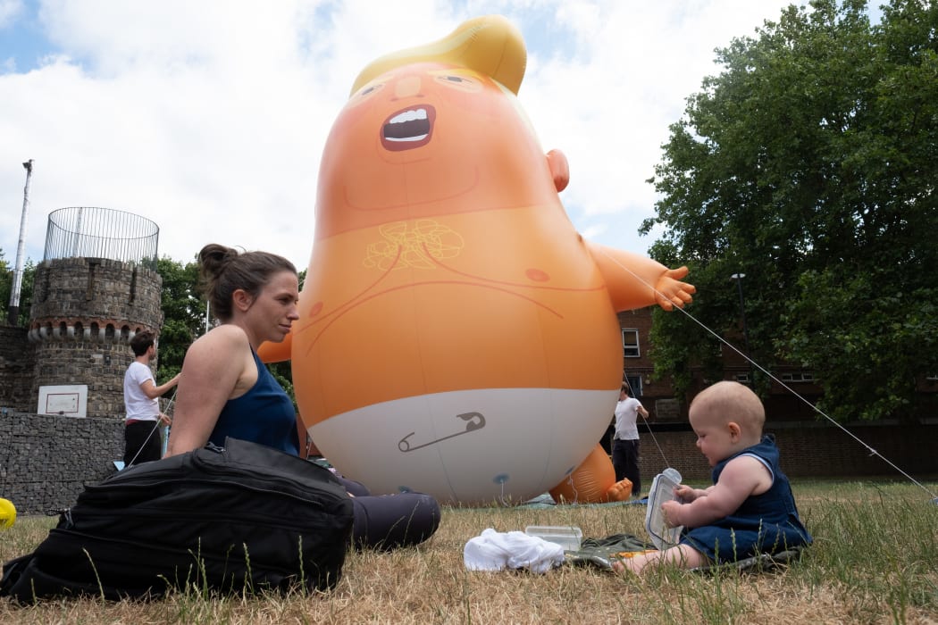 British activists created a giant baby Trump balloon to take part in protests against the US president in London on 13 July.