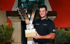 Ryan Fox holds the Le Vaudreuil Challenge trophy.