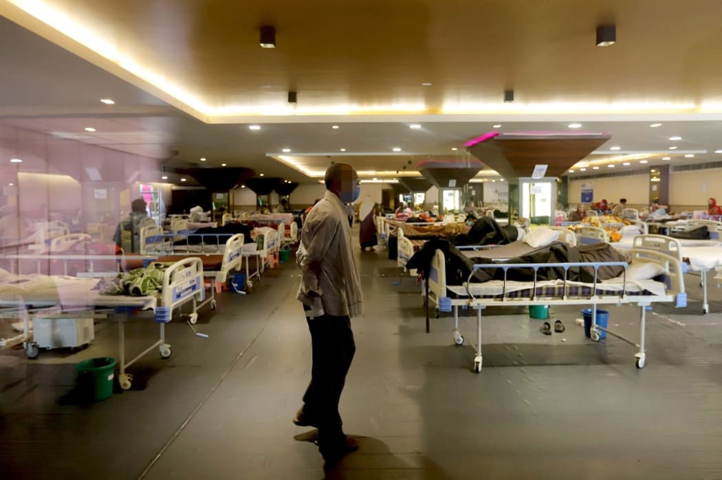 NEW DELHI, INDIA - APRIL 15: Patients take a stroll at a quarantine center for Covid-19 coronavirus infected patients at a banquet hall that was converted into an isolation center to handle the rising cases of infection in New Delhi on April 15, 2021.