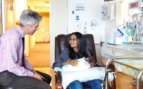 Frank Bloomfield wtih Meeta Raval of Auckland and her baby boy Arjun.