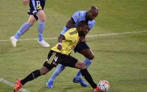 Roly Bonevacia (left) of the Phoenix fights for possession with Mickael Tavares of Sydney FC.