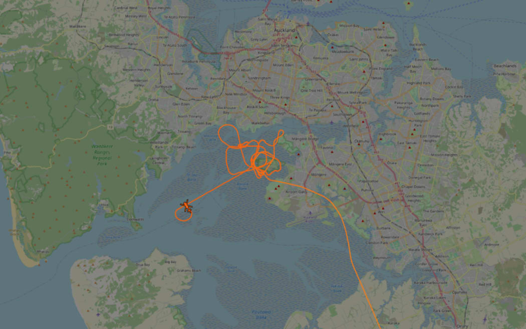 One of the helicopters involved in a search over Manukau Harbour in Auckland.
