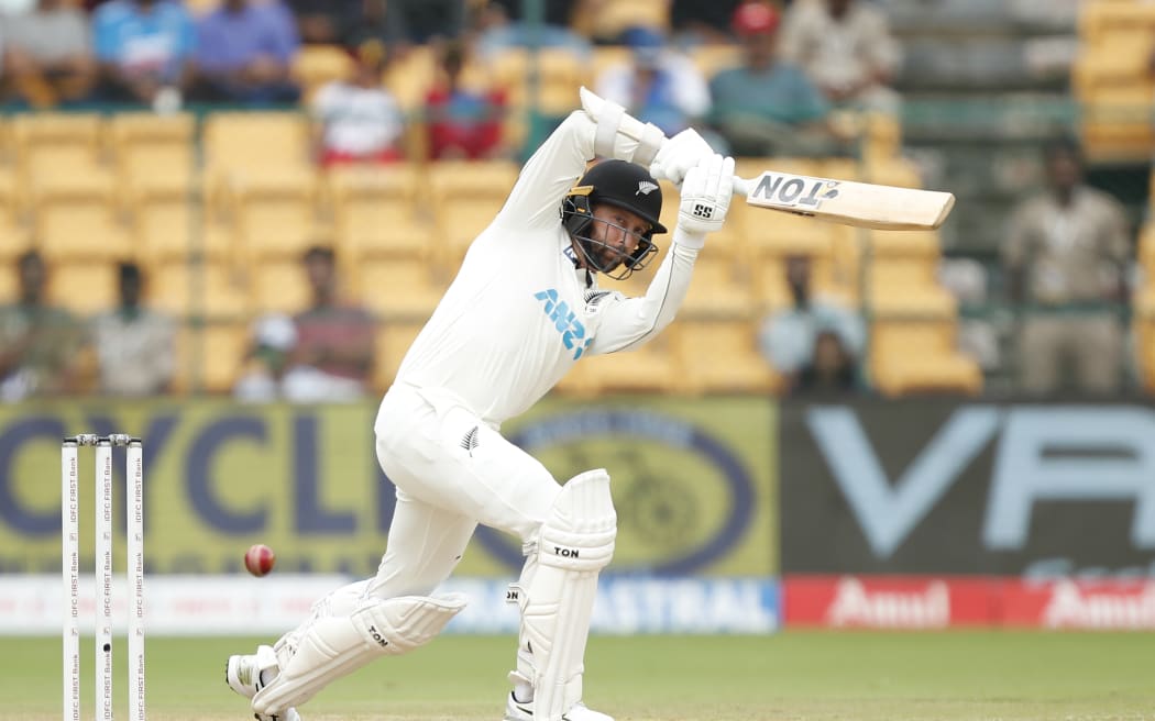 Devon Conway of New Zealand play a shot