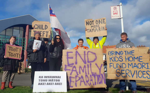 Group of people with placards