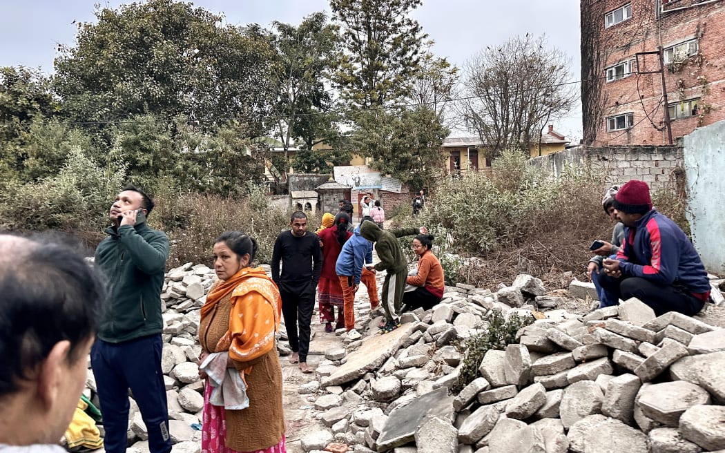 People gather in an open area following a major earthquake, in Kathmandu, on 7 January, 2025.