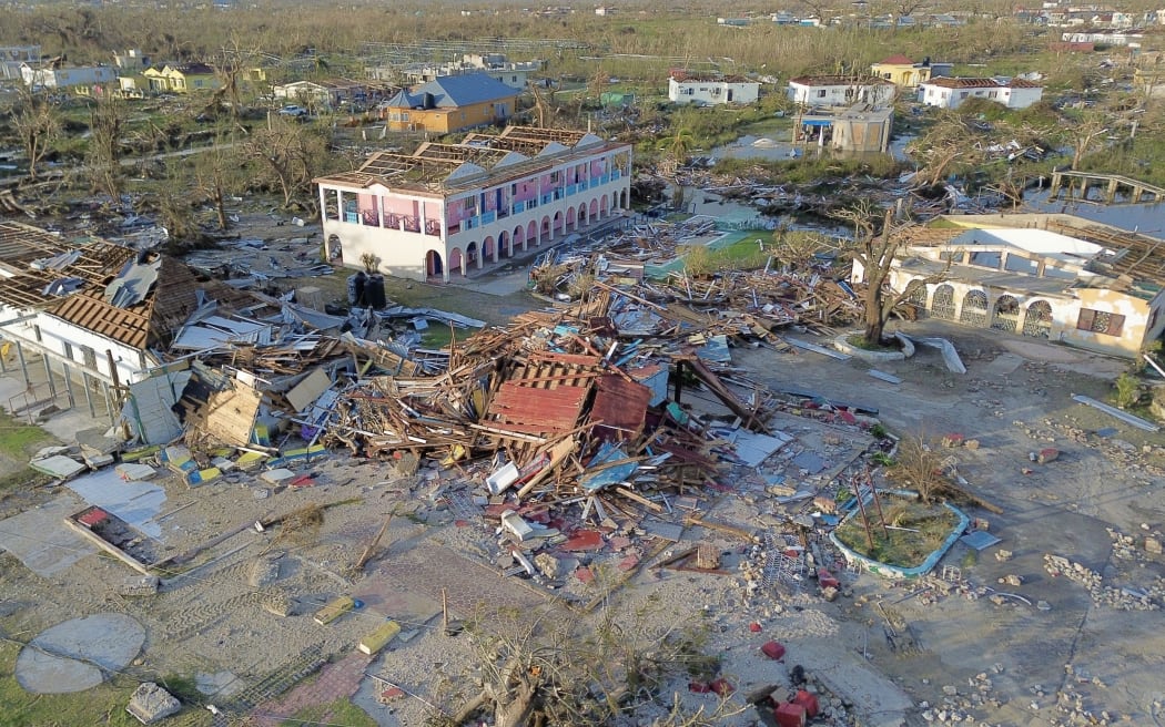 An aerial view of destroyed buildings following the passage of Hurricane Melissa, in Black River, St. Elizabeth, Jamaica on October 29, 2025. Hurricane Melissa bore down on the Bahamas October 29 after cutting a path of destruction through the Caribbean, leaving 30 people dead or missing in Haiti and parts of Jamaica and Cuba in ruins. 
Somewhat weakened but still threatening, Melissa will bring damaging winds and flooding rains to the Bahamas Wednesday before moving on to Bermuda late Thursday, according to the US National Hurricane Center (NHC). (Photo by Ricardo MAKYN / AFP)