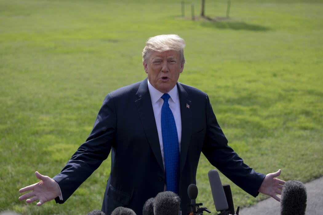 United States President Donald J. Trump speaks with members of the media prior to boarding Marine One for his departure from the White House on October 2, 2018 in Washington, DC. Photo Credit: Alex Edelman/CNP | usage worldwide