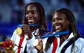 Serena and Venus Williams of USA on the podium with their gold medals for the Womens Doubles Tennis at the Sydney Olympics 2000.