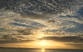 Cloudy sunrise on Eastern Beach, Auckland New Zealand