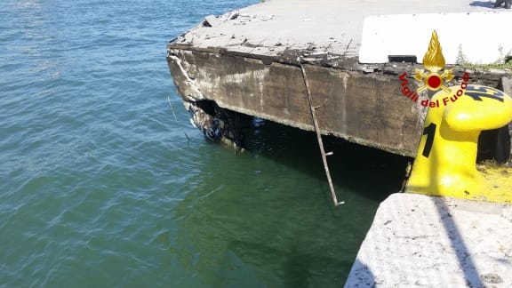 A view of the damaged harbor quay after the MSC Opera cruise ship collided with a tourist boat in Venice, Italy, Sunday, June 2, 2019.