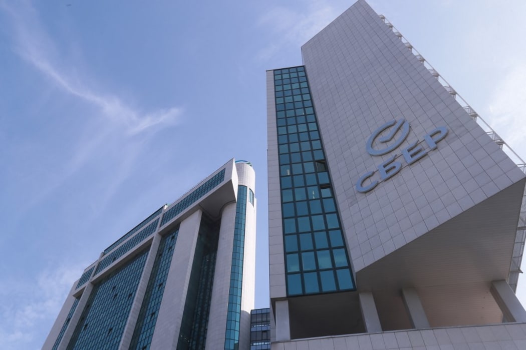 A sign with the new Sber logo is displayed at the Bank's main office in Moscow, Russia.