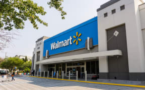 August 7, 2018 Mountain View / CA / USA - People going in and coming out of a Walmart store on a sunny day, south San Francisco bay area