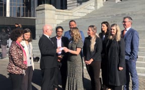Rebecca Toms presenting a petition to Parliament.