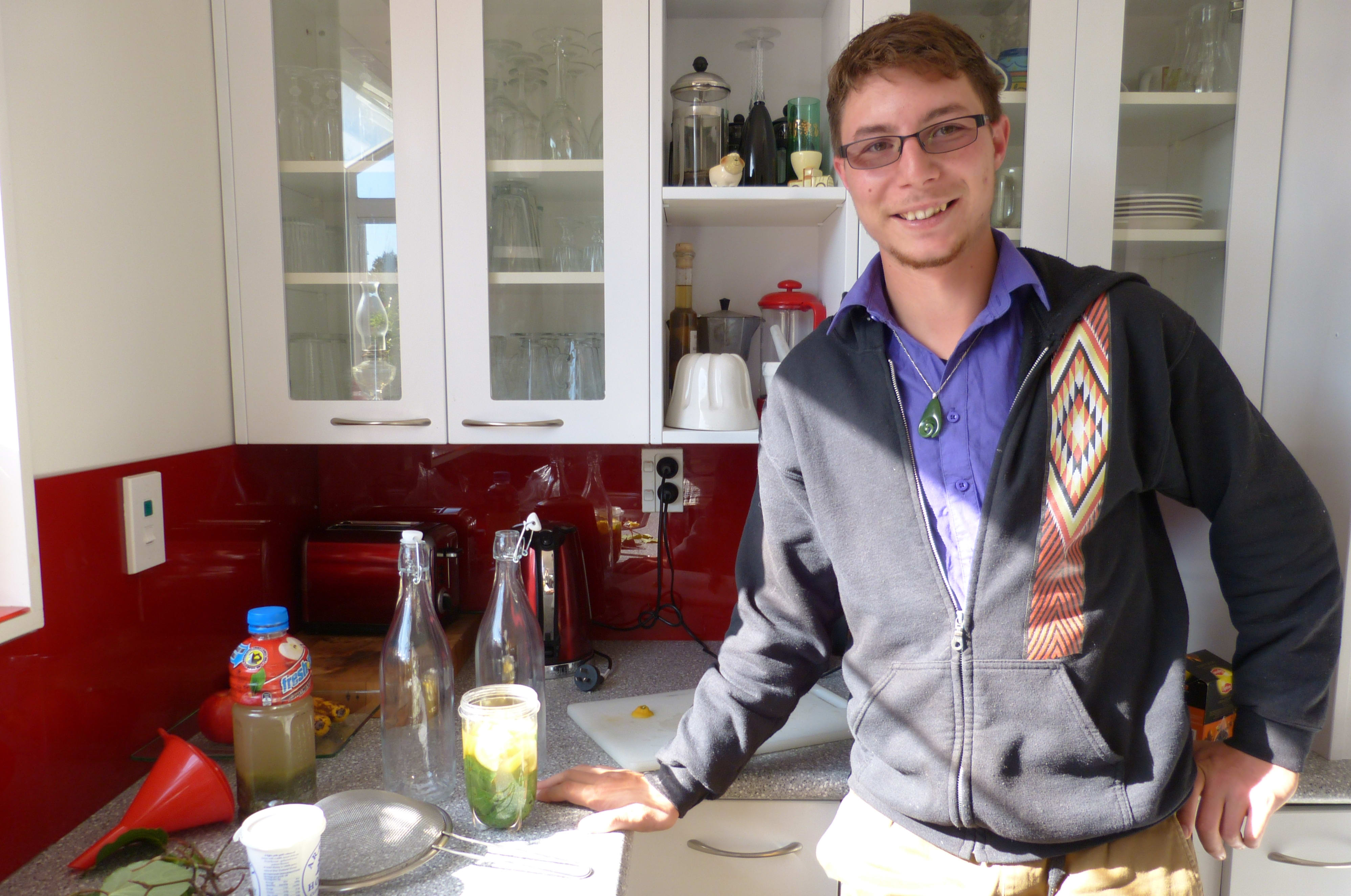 Jordon Wansbrough prepares a medicine using kawakawa leaves.