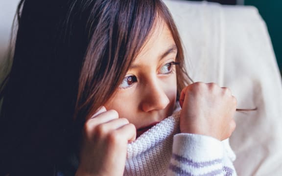 brown haired girl looking shy