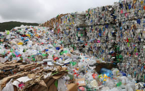 Bales of mixed plastic wait for export at Wellington's recycling facility at Seaview.