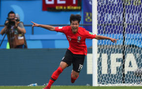 South Korea's defender Kim Young-gwon celebrates his goal during his team's winning Group F match against Germany.