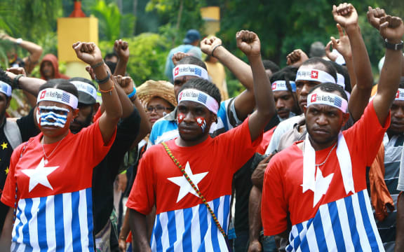Papuan students take part on a rally in Surabaya, East Java province, in December 2013, demanding the freedom of West Papua province.