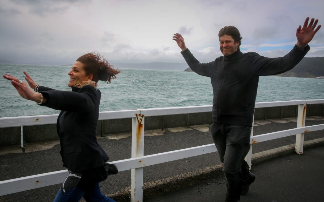 Jenny and Johan Grobler of Auckland embracing the wild wind of Wellington at Greta Point.