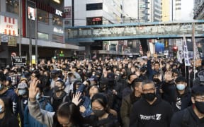 Pro-democracy protesters at an event on 8 December.