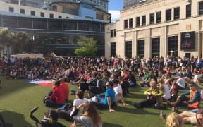 Hundreds gather to pay their respects to the victims of the Paris attacks in Wellington on 17 November 2015.