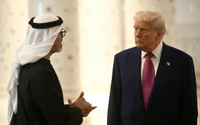 US President Donald Trump listens to Abu Dhabi's Crown Prince Sheikh Khaled bin Mohamed bin Zayed Al Nahyan, as he visits the Sheikh Zayed Grand Mosque in Abu Dhabi on May 15, 2025. The United Arab Emirates is the third leg of Trump's visit to the region, which has already taken him to Saudi Arabia and Qatar. (Photo by Brendan SMIALOWSKI / AFP)