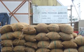 Bags of copra stacked for weighing at the Tobolar Copra Processing Authority milling plant in Majuro