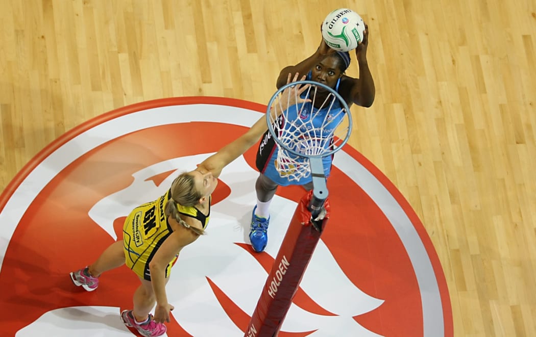 Steel's Jhaniele Fowler-Reid takes a shot at goal while defended by Pulse's Katrina Grant in the ANZ championship netball match, Steel v Pulse, ILT Stadium Southland, Invercargill, New Zealand, Monday, April 14, 2014.