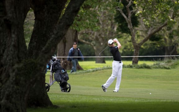New Zealand's James Anstiss hits to the green  on the 18th during the Asia-Pacific Amateur golf Championship at the Royal Wellington Golf course 2017.