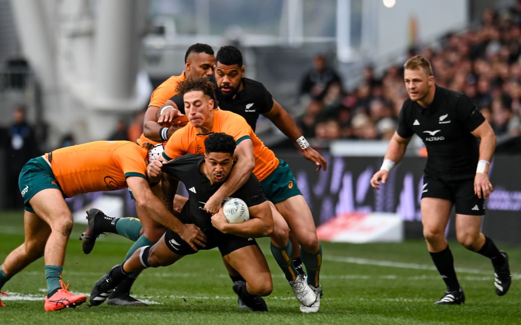 All Black Leicester Fainga'anuku is tackled by Mark Nawaqanitawase of Australia during the All Black v Wallabies Bledisloe Cup rugby Test at Forsyth Barr Stadium in Dunedin.