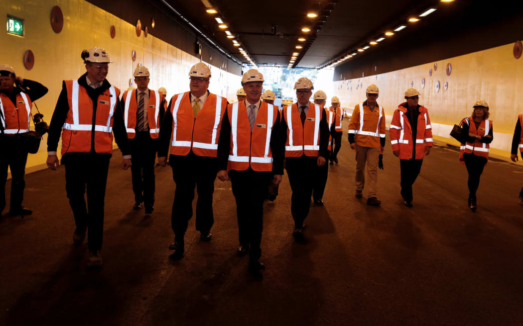 Prime Minister John Key (centre) in the newly named Arras Tunnel under the National War Memorial Park site in Wellington.
