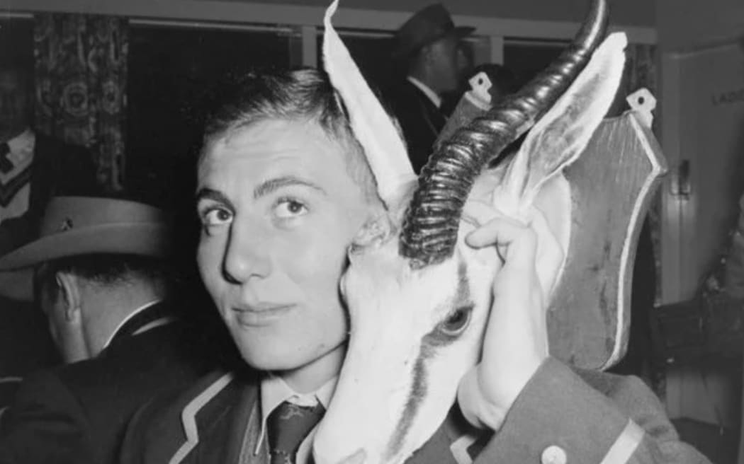 Piet du Toit holds the broken springbok head, 1956