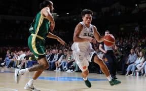 Reuben Te Rangi of the Tall Blacks and Xavier Cooks of the Boomers.