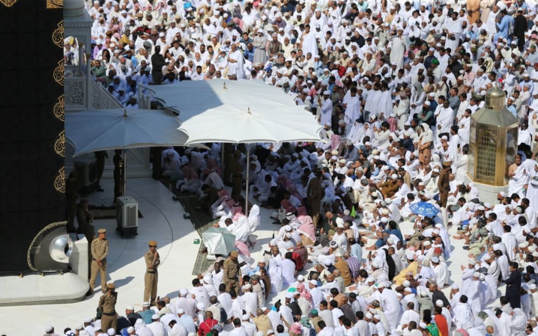 Muslims gather around the Kaaba, Islam's holiest shrine, at the Grand Mosque in Saudi Arabia's holy city of Mecca on November 16, 2018, to take part in the absentee funeral prayer for Saudi journalist Jamaal Khashogg.