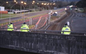 Police monitoring a checkpoint in Mercer, near Auckland's border with Waikato.