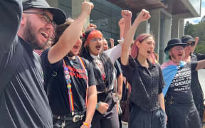 Supporters of the legal action outside court in Brisbane. (ABC News: Janelle Miles)