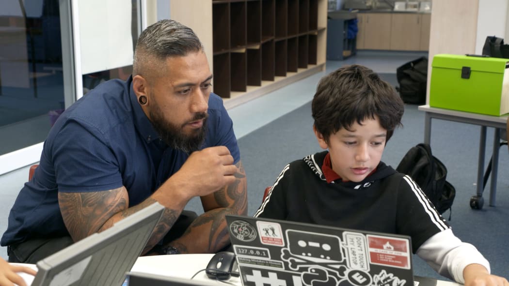 Ron Amosa (left) working with Davey (right) on a coding excercise.
