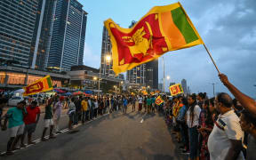 Anti-government demonstrators take part in a protest near the President's office in Colombo on 10 May 2022.