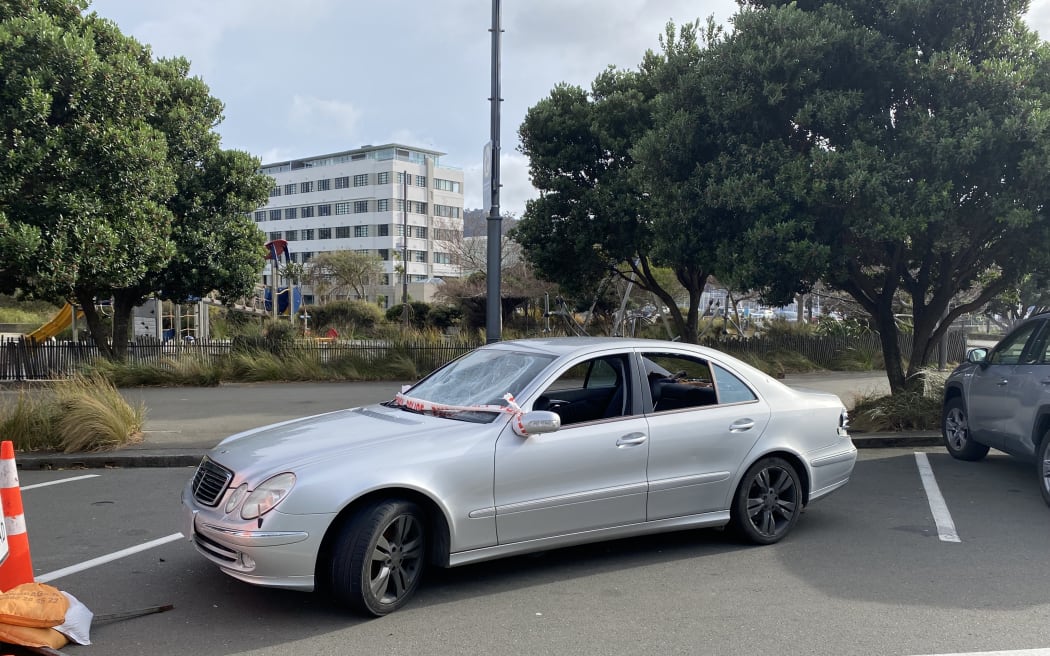 The damaged car sat damaged across multiple car parks on a busy Wellington street for more than a week.