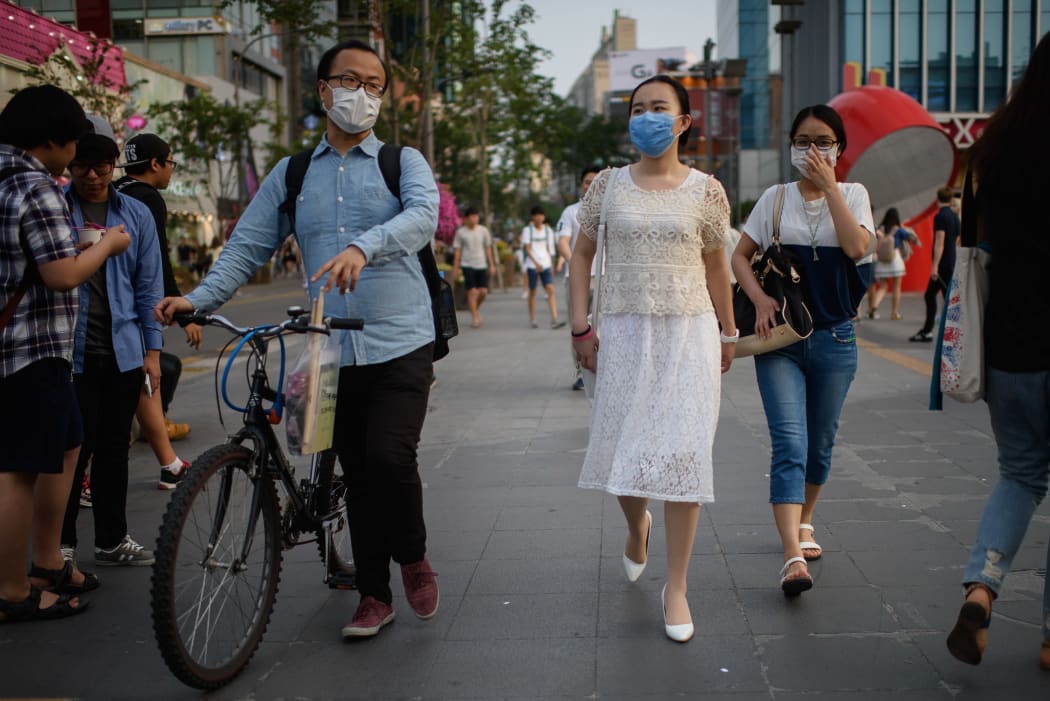 People wearing face masks in Seoul.