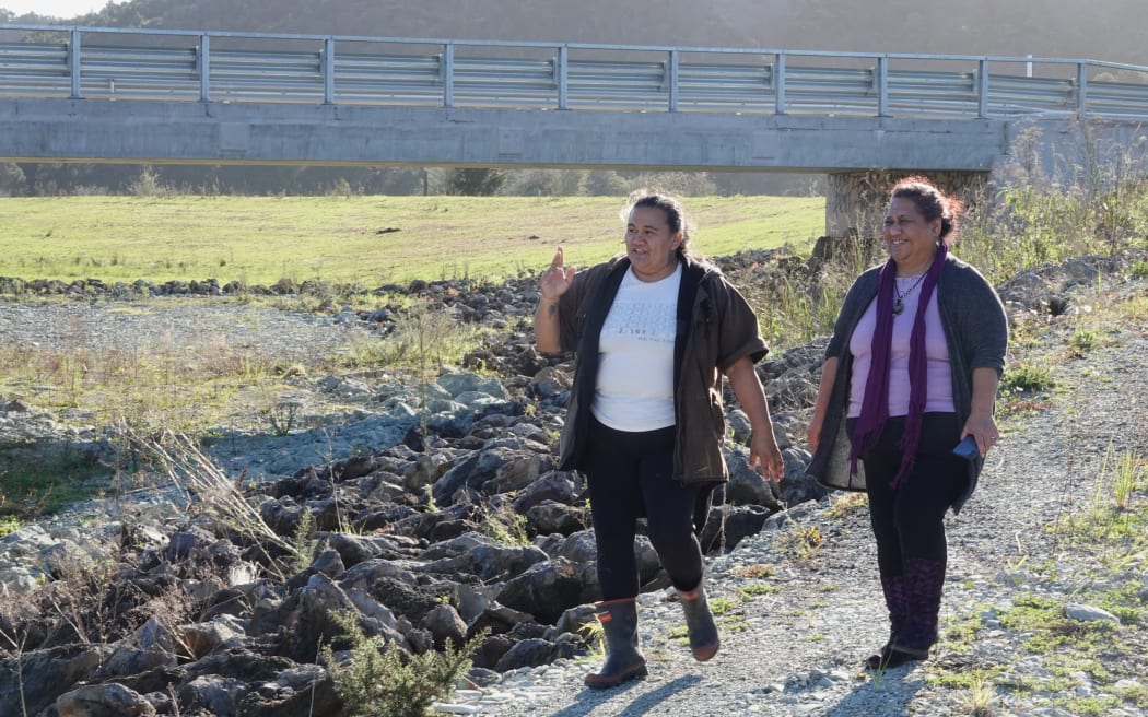 Community advocate Pamela-Anne Ngohe-Simon and landowner Josephine Kemp-Baker (Ngāti Kopaki) inspect a flood reduction scheme upstream from Moerewa.