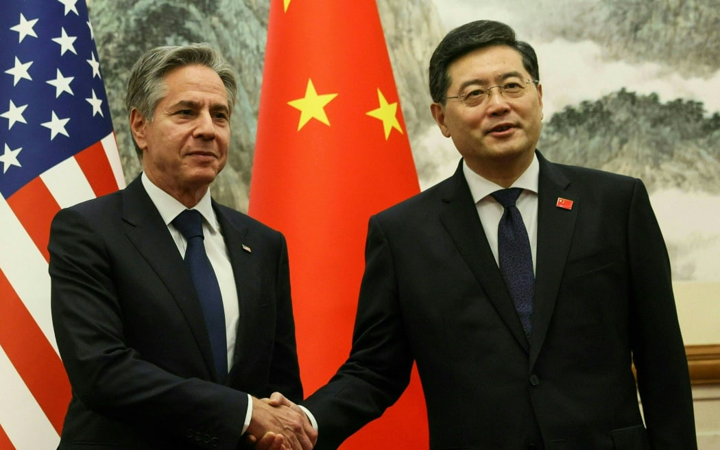 US Secretary of State Antony Blinken (L) and China's Foreign Minister Qin Gang shake hands ahead of a meeting at the Diaoyutai State Guesthouse in Beijing on June 18, 2023. (Photo by LEAH MILLIS / POOL / AFP)