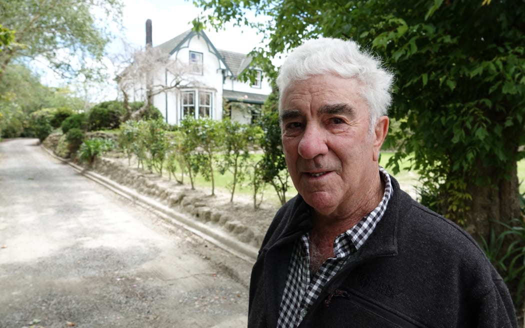 Rowley Powdrell is working to clear silt from his property.