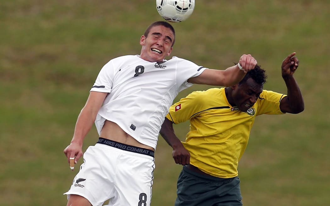Vanuatu's Brian Kaltack fighting for possession against the All Whites.