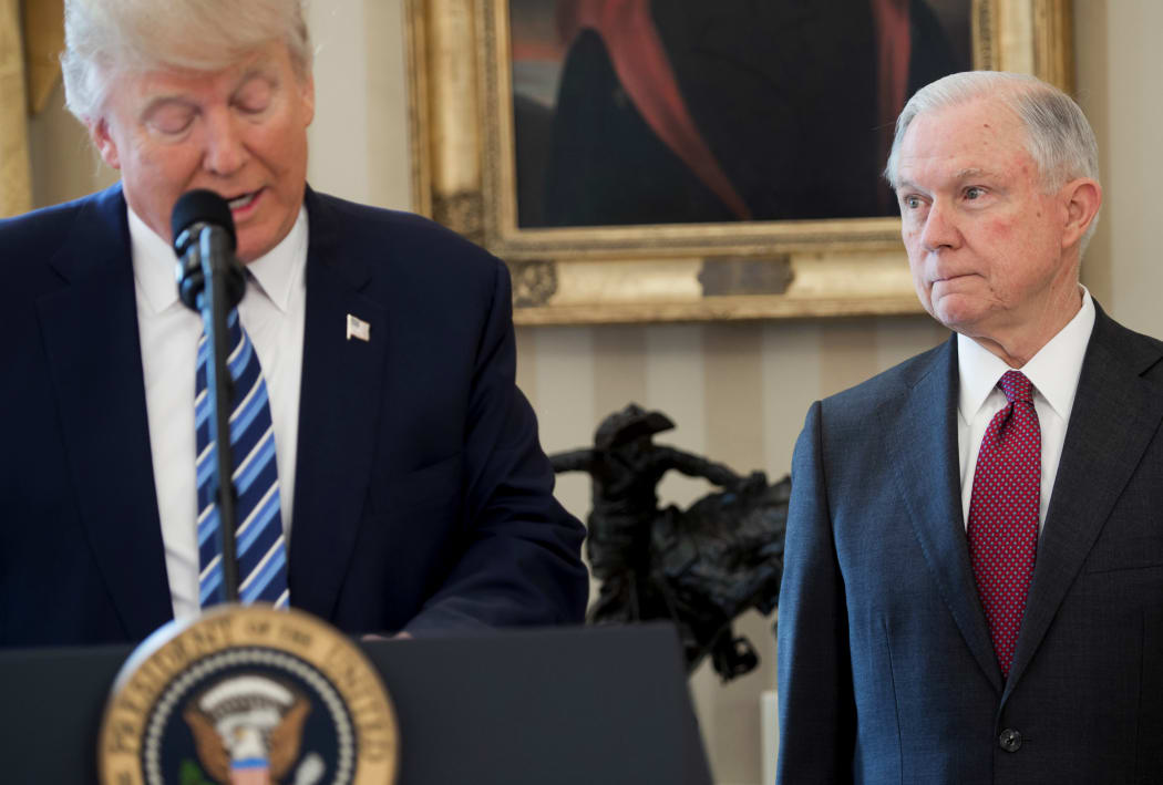 US President Donald Trump alongside US Attorney General Jeff Sessions after Sessions was sworn in as Attorney General in the Oval Office of the White House in Washington, February 9, 2017
