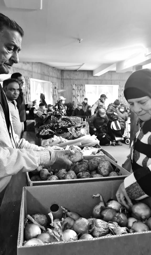 EKTA's volunteers distributing food at St Peter's Church, Wellington
