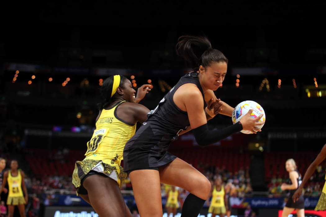 Maria Tutaia takes the ball from Vangelee Williams