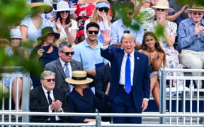 Former US President Donald Trump waves as he attends the graduation ceremony of his son, Barron Trump, at Oxbridge Academy in Palm Beach, Florida, May 17, 2024. (Photo by Giorgio VIERA / AFP)